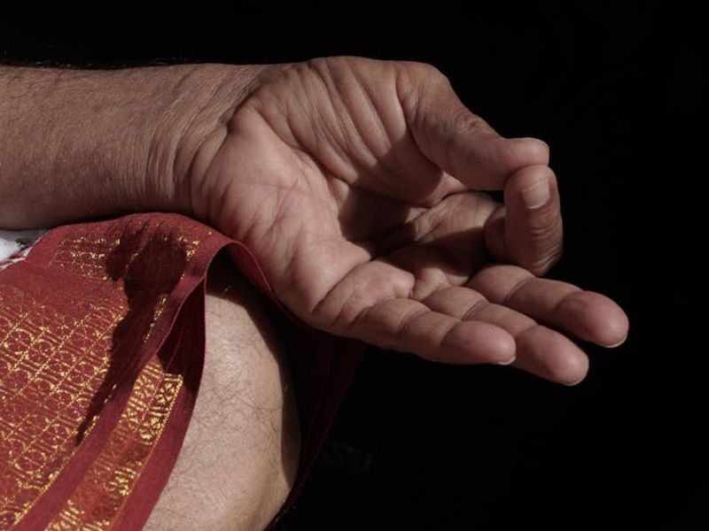 Close up of yoga hands in mudra position.
